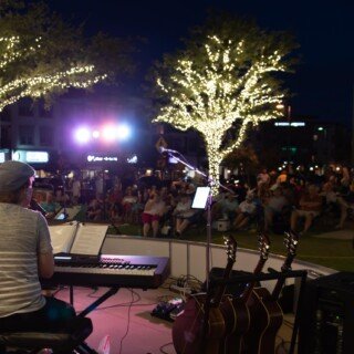 Johnny at piano - night -  back shot